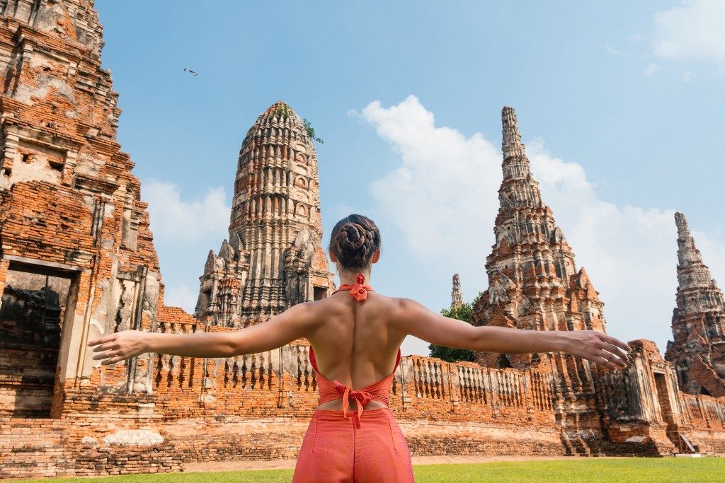 woman posed in front of the temples