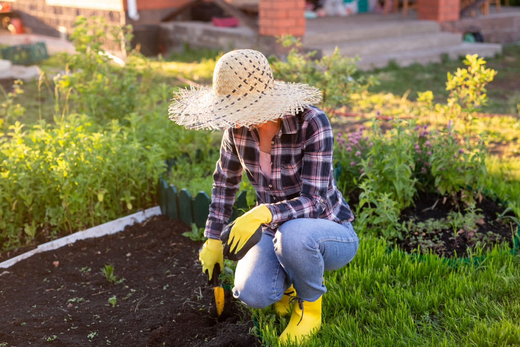 A woman gardening during a sunny day